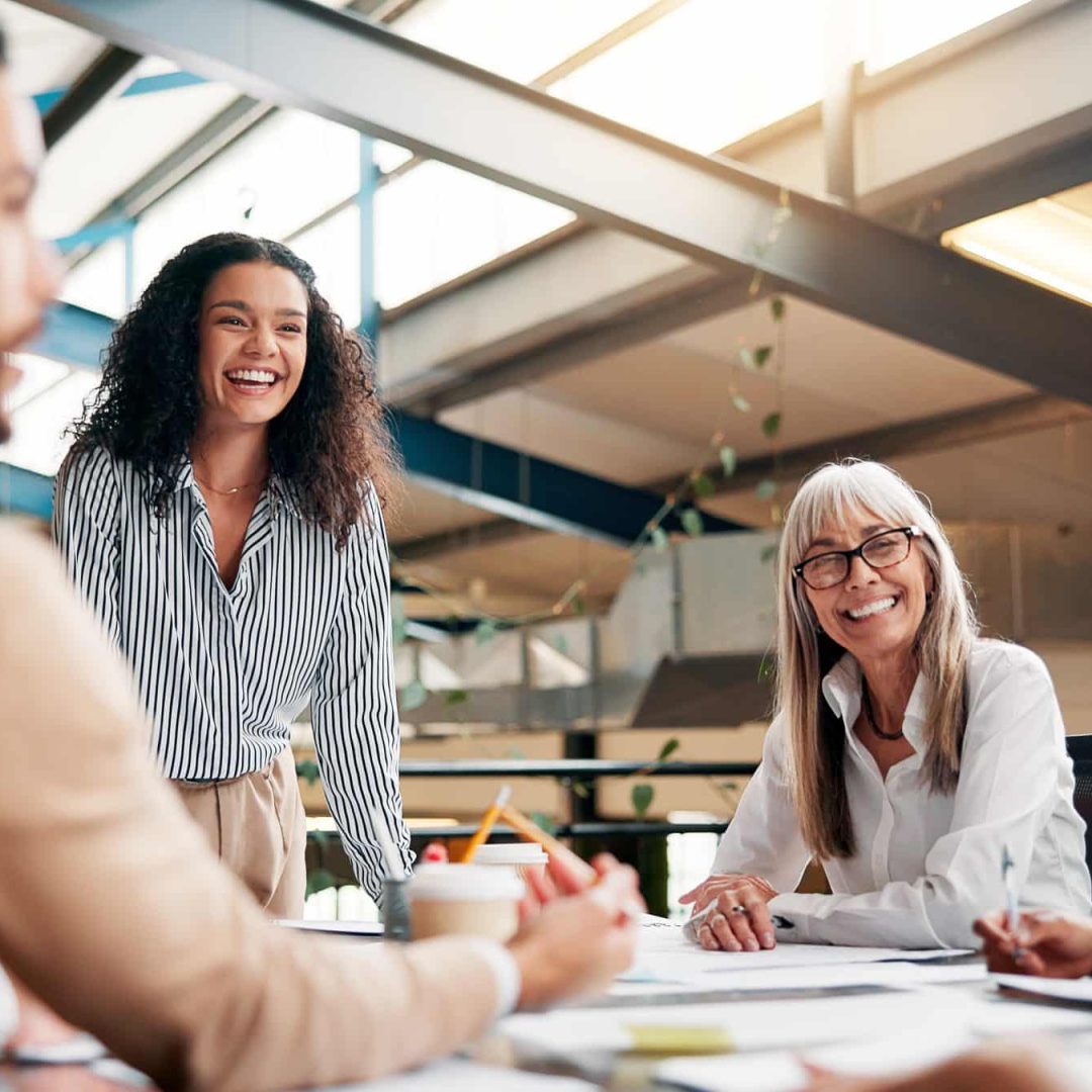 Brainstorming, speaker and woman in boardroom, laughing and brand specialist with ideas for project. Business, creative and people with strategy for target audience, trends and speech for workshop.